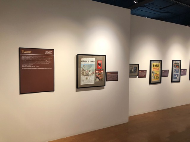 artifacts of racism displayed on gallery wall