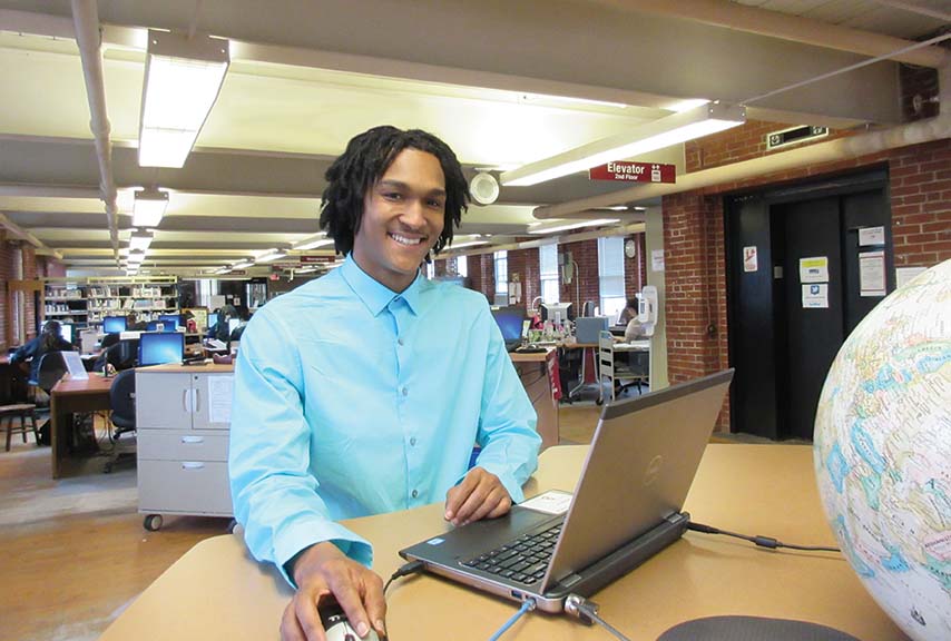 Student at computer in the library