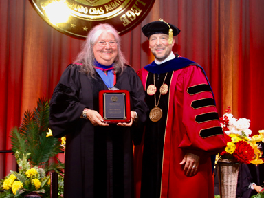 Dr. Carberry receving Distinguished Alumna Award at Commencement