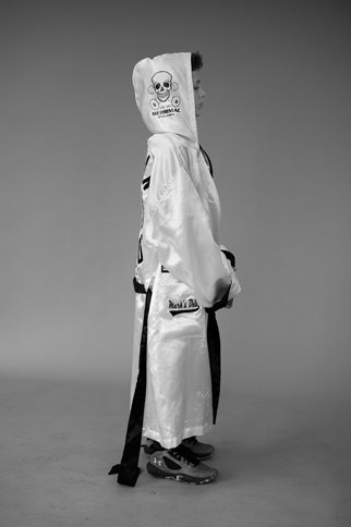 Twelve-year-old Northampton resident Greysen Bringaze wears a boxing robe that belonged to Joshua Raineri, aka 