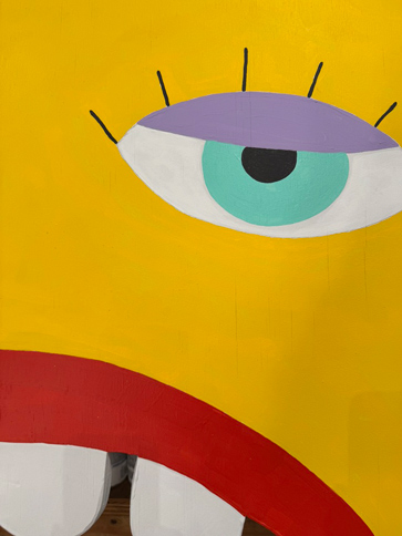 half a bright yellow face