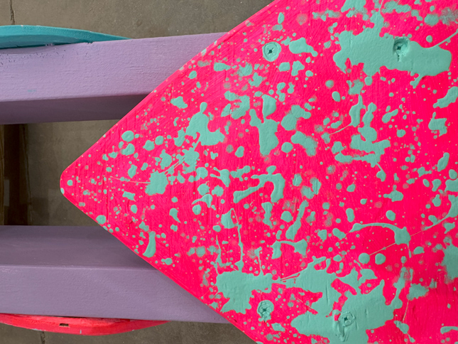 pink triangle with white paint splattered