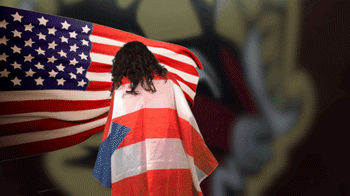 Byanka Cedrez with Puerto Rican flag drapped over her