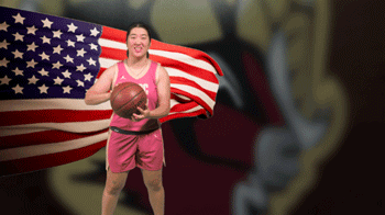 Molly Pingxian Smith Eilenberg holds ball toward camera