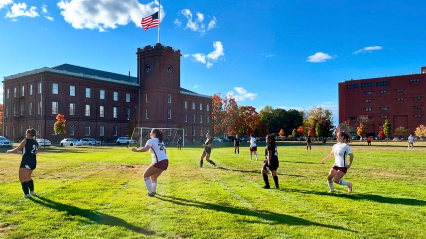 women's soccer game in front of Armory Museum