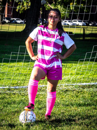 Mireya Rojas standing on soccer ball