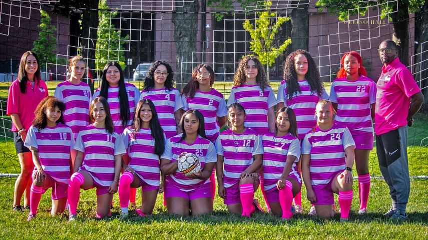 Women's Soccer team lined up in front of net