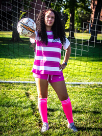Miley Sanchez palming soccer ball out front with one hand
