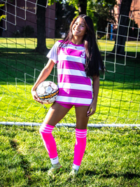 Geysha Perez casually holding a soccer ball