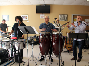 band with hand drums playin at latin food tasting