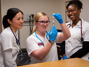 nursing students preparing needle