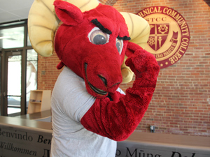 STCC mascot Rowdy the Ram in front of the STCC seal