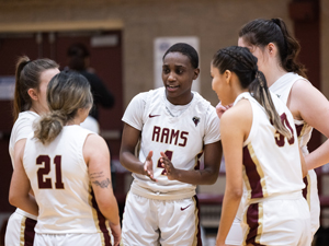 Women's Basketball players huddling