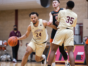men's basketball player making an offensive drive
