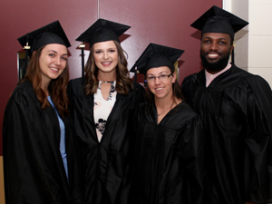 graduates in cap and gown at commencement