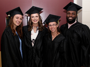 graduates in cap and gown at commencement