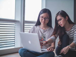 two women playing an online game