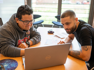 students at laptop for online learning orientation