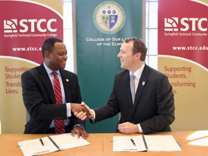 Elms College and STCC presidents shaking hands