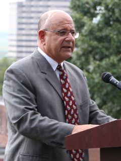 Zahi Haddad giving a speech into a micophone at a lectern