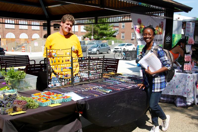 student buying handcrafted jewelry