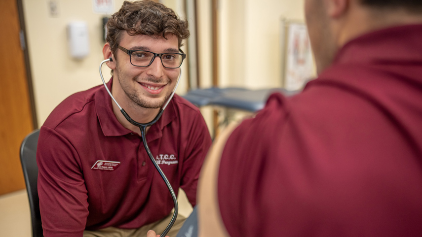 Physical Therapy student taking blood pressure