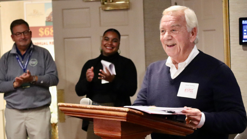 Brian Touhey speaking at alumni event