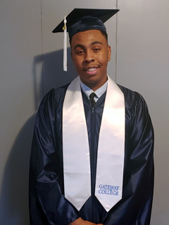 Daniel Doby in graduation cap and gown