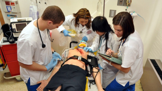 health science students working on simulation dummy