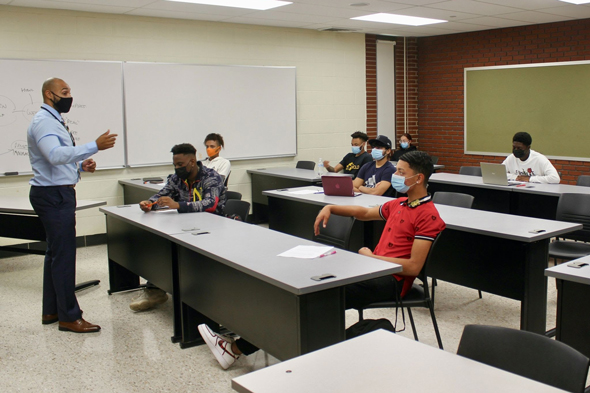 MILE instructor in front of students in classroom