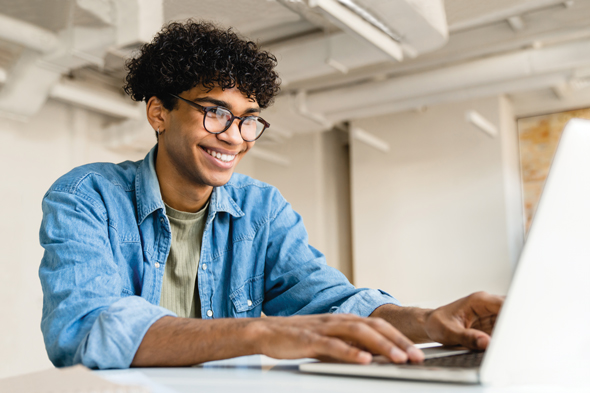 online student working on laptop