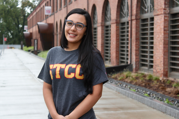 STCC smiling in front of Student Learning Commons