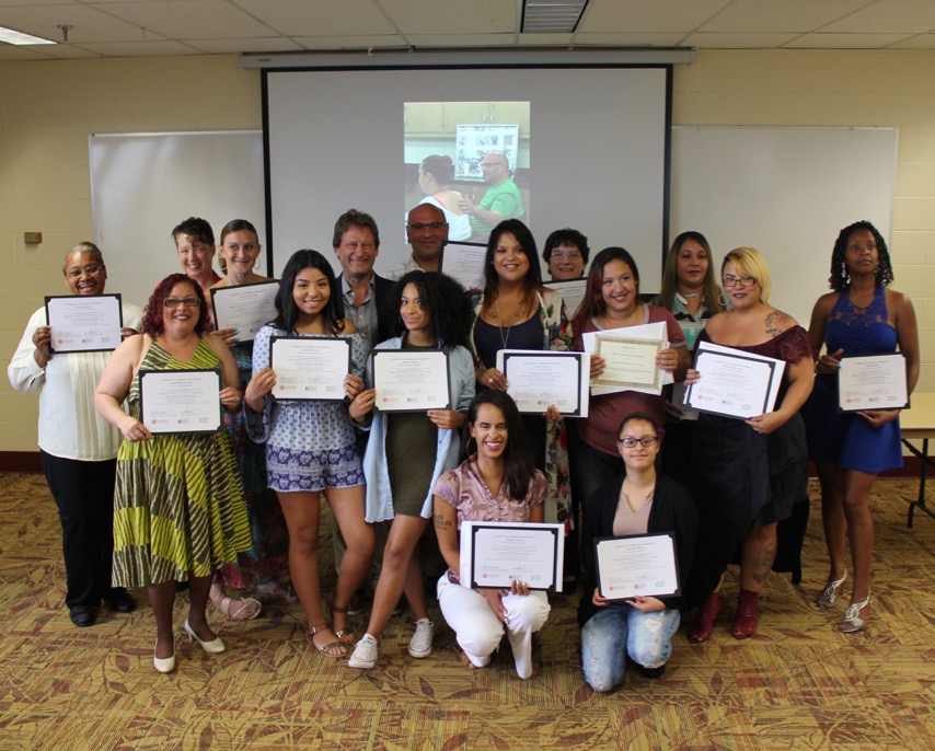 HHA graduates stand with their certificates