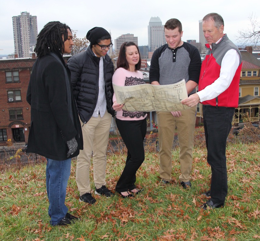 Warren Hall, students look at map