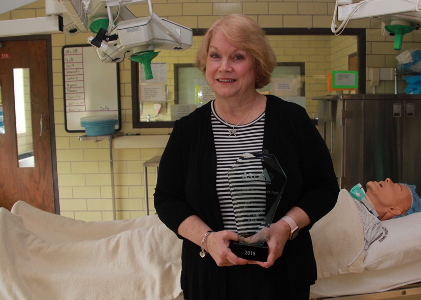 Faculty member holds award