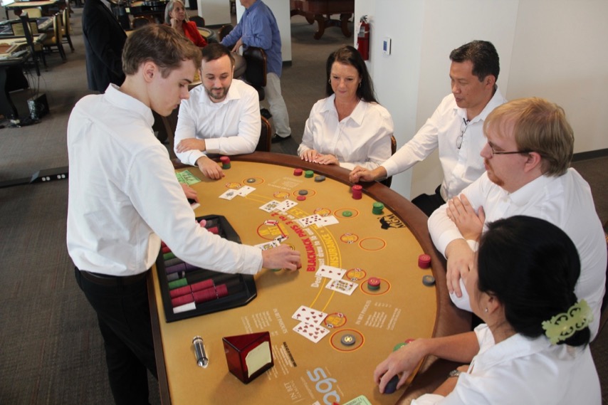 Blackjack dealers at table