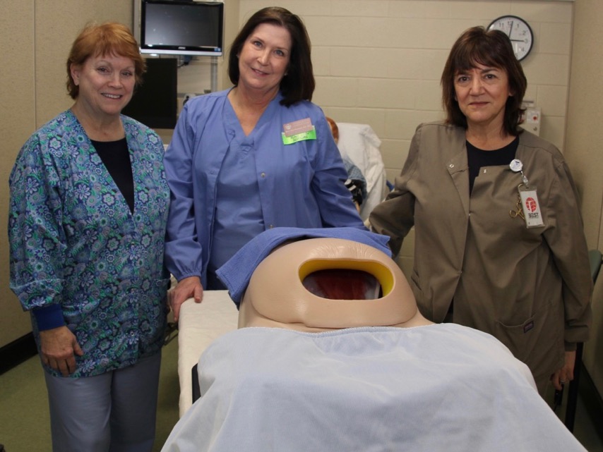 Surgical Tech staff with a simulator