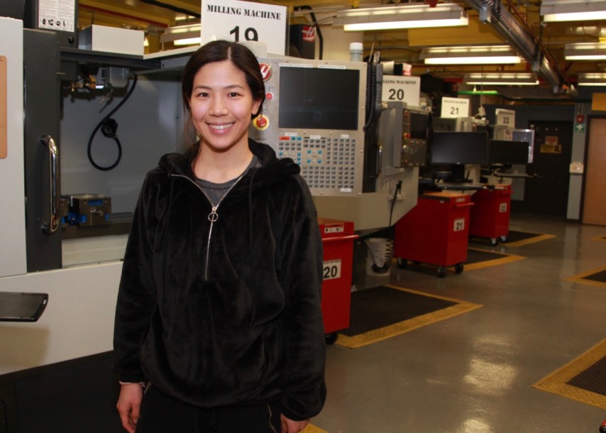 Student Robin Song, a working engineer, stands in MET lab