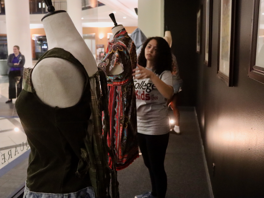 College for Kids student decorates mannequin