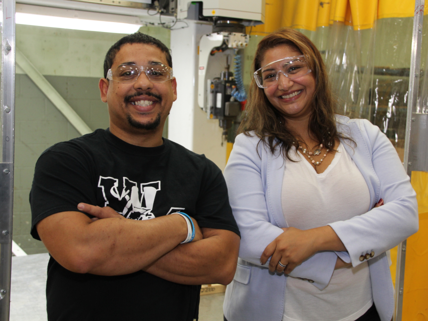 Pia Kumar and Miguel Fontanez with arms crossed