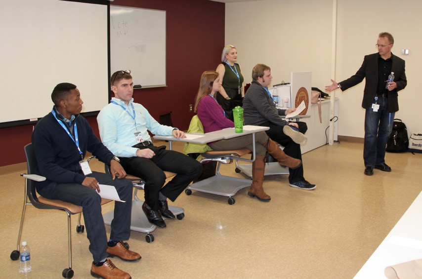 Interns from IT Academy are seated in a STCC classroom