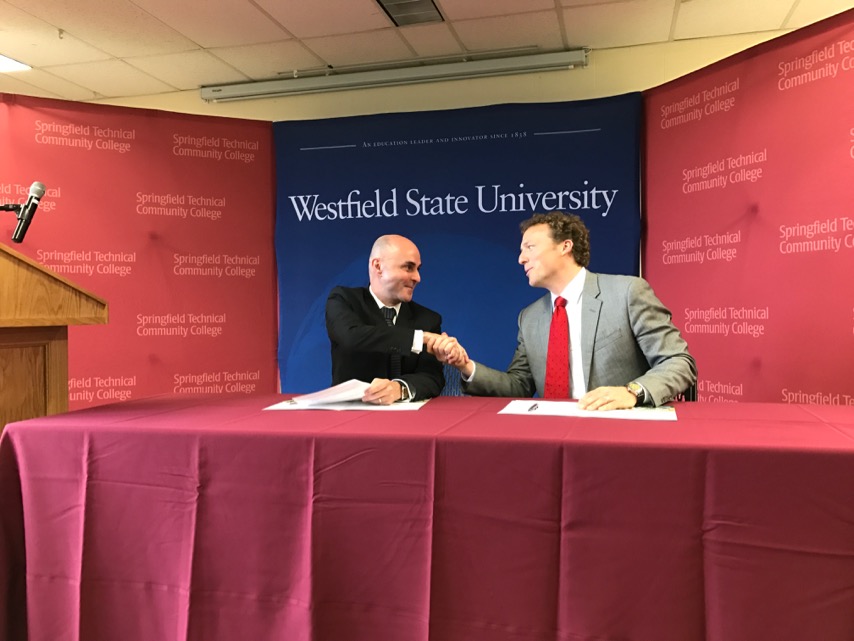 Westfield State University president shakes hands with STCC president