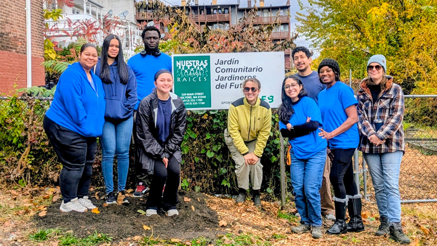 Phi Theta Kappa members volunteering at community garden