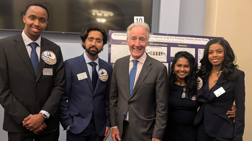 students dressed formally with state representative Richard Neal
