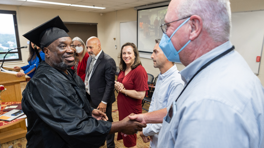 HiSET graduate shaking hands