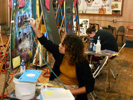 girl airbrushing colorful paints