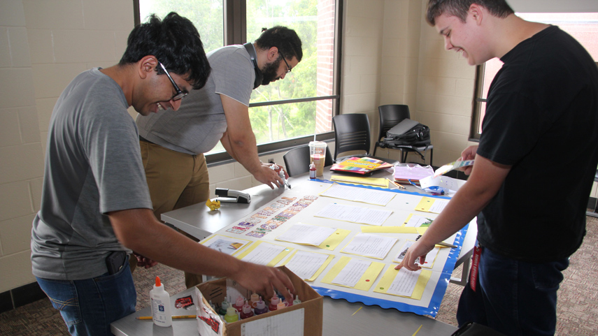 summer bridge students working together on poster team project