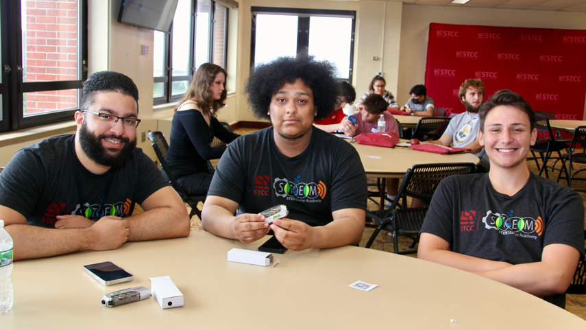 summer bridge students at round table in lounge