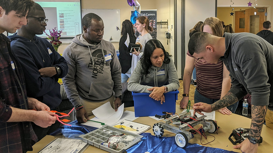 coding and robotics team assembling robot