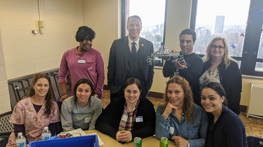 coding and robotics team with robot and STCC president